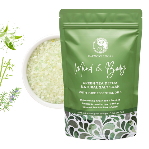 Green Tea Detox Infusion bath sea salt mix in a clear jar with fresh leaves.