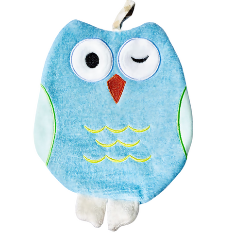 Ollie the Owl terry bath mitt displayed on a bathroom shelf.